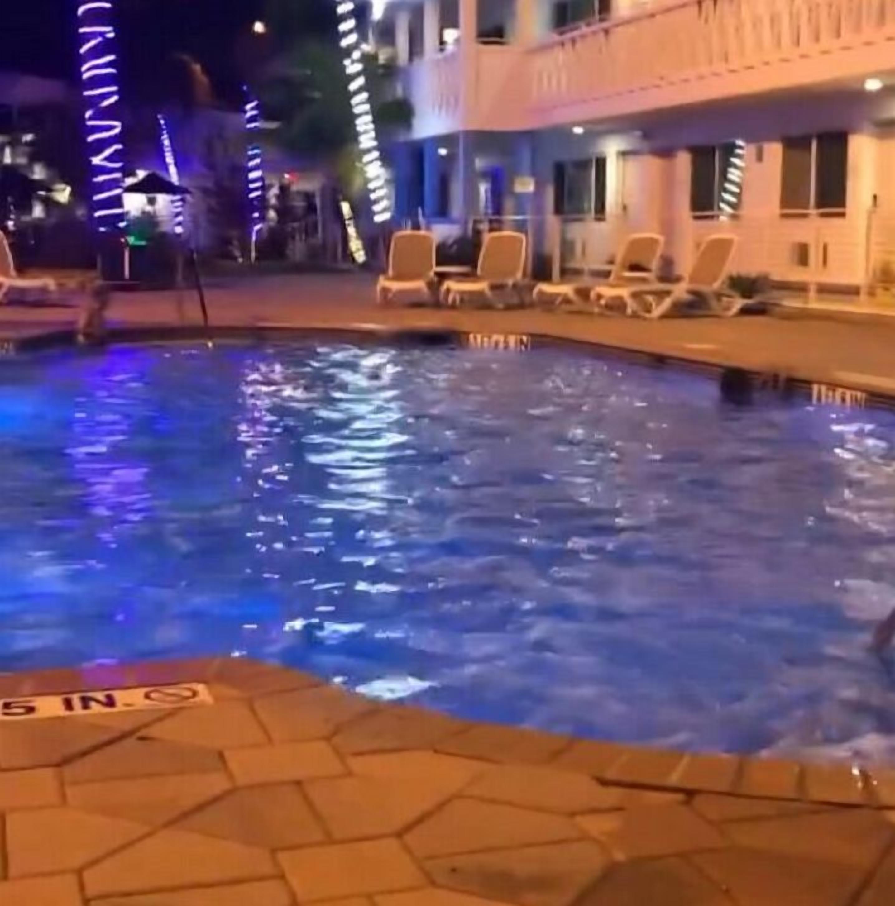 outdoor pool, open 8:00 am to 11:00 pm, pool loungers