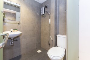 A small bathroom with a toilet, a sink, and a shower. - D'Garden Boutique Hotel Kuala Lumpur (Kuala Lumpur)