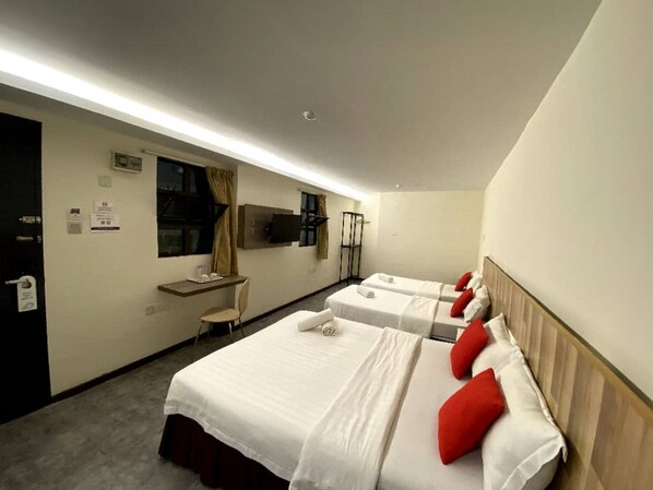 A hotel room with two beds, a desk, a chair, a TV, and a window with curtains. - D'Garden Boutique Hotel Kuala Lumpur (Kuala Lumpur)
