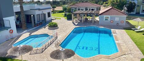 Seasonal outdoor pool, open 9:00 AM to 7:00 PM, sun loungers