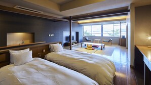 A modern hotel room with two large beds, a TV, a desk, and a view of the outdoors. - Itsukushima Iroha  (Hatsukaichi)