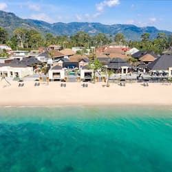 On the beach, white sand, sun-loungers, beach umbrellas