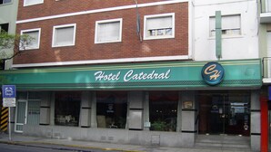 A hotel named Hotel Catedral with a green awning and a sign featuring a stylized 'C' logo. - Hotel Catedral (Mar del Plata)
