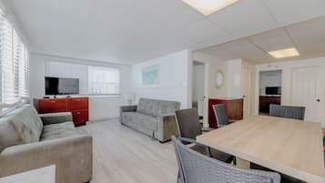 Apartment, 2 Bedrooms (Condo Apartment, 2nd Floor, G Unit) | Living area | 32-inch LCD TV with cable channels, TV, books