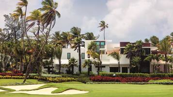 Experience luxury amidst lush gardens and a golf course, with a serene atmosphere and modern design.