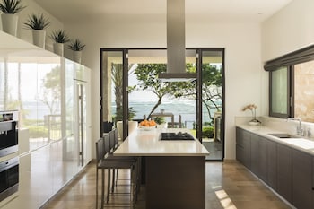 House, 5 Bedrooms, Balcony (Oceanfront) | Private kitchen | Fridge, microwave, oven, coffee/tea maker at Residences at Dorado Beach, a Ritz-Carlton Reserve