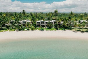 On the beach, beach cabanas, sun loungers, beach umbrellas