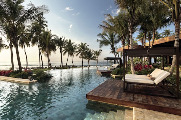2 outdoor pools, a waterfall pool