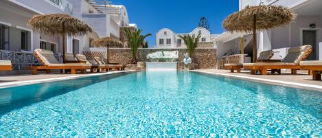 Outdoor pool, pool umbrellas, sun loungers