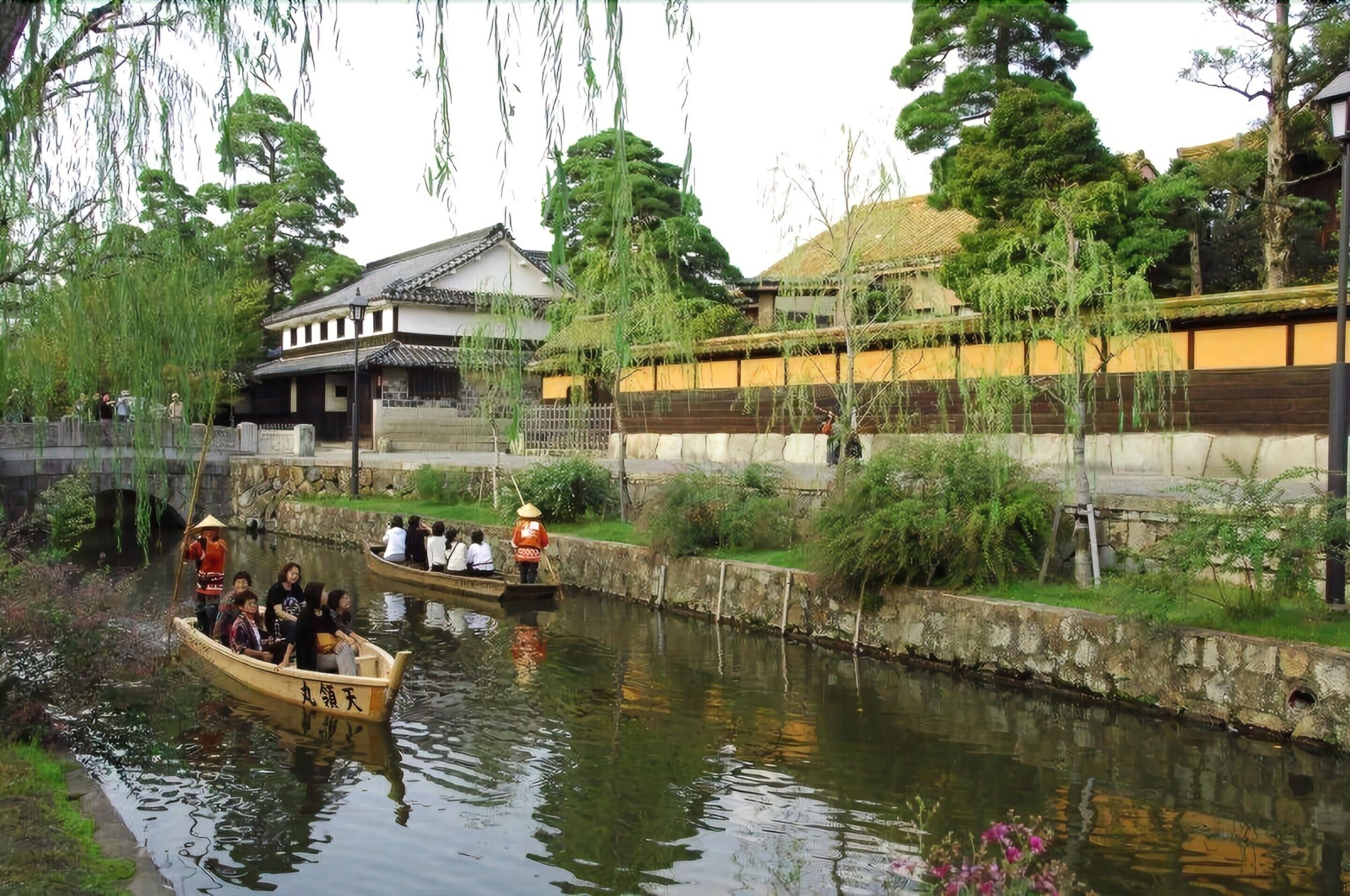 A traditional Japanese building with a thatched roof and wooden walls.