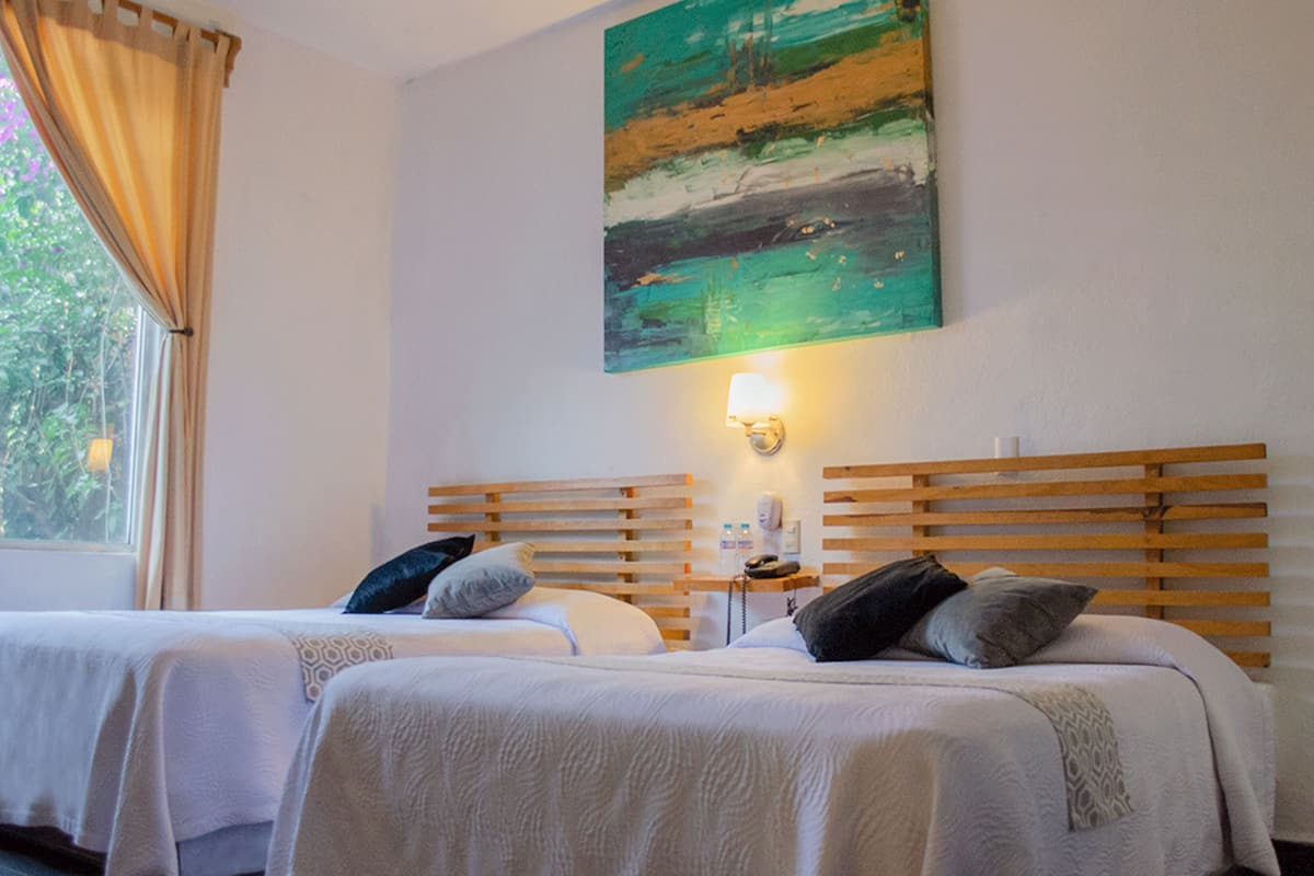 Standard Room, 2 Queen Beds | Desk, iron/ironing board, free WiFi, bed sheets