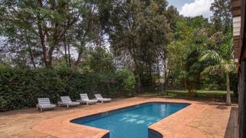 Outdoor pool, open 8 AM to 6 PM, free cabanas, pool umbrellas