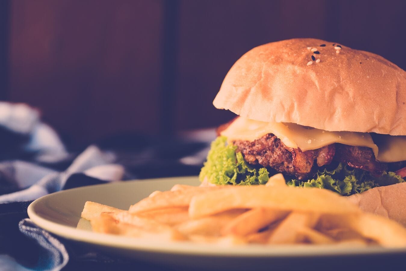 A plate with a burger and fries.