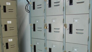A row of metal filing cabinets with numbered labels, likely used for storage in an office or institutional setting. - Lucky House Dorm Room - Hostel (Ko Phi Phi)