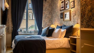 Luxe beddengoed, een minibar, een kluis op de kamer, een laptopwerkplek