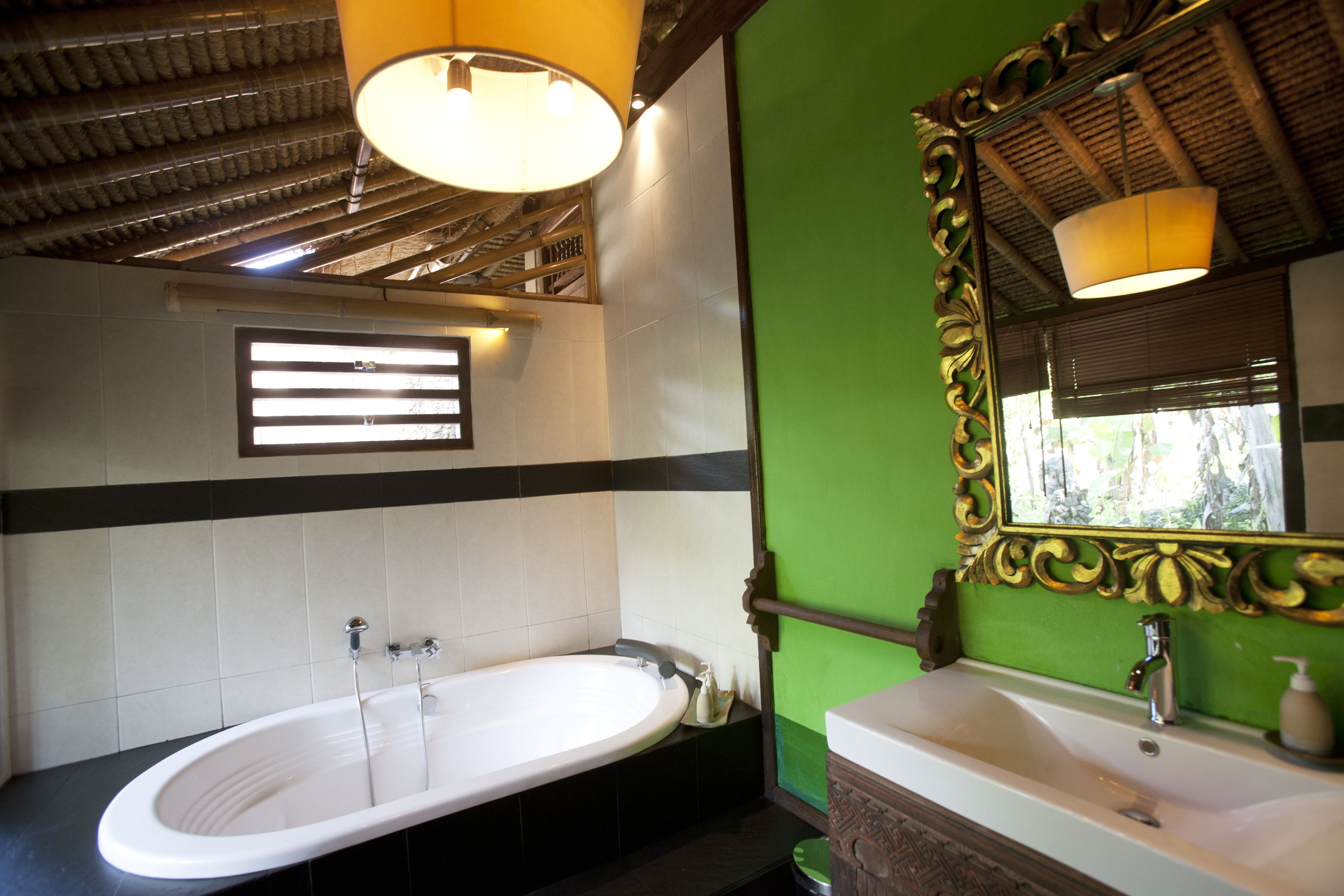 deluxe double room | bathroom | bathtub, deep-soaking bathtub, hair dryer, slippers