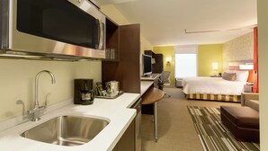 A hotel room with a kitchenette, a bed, a desk, and a bathroom. - Home2 Suites by Hilton Salt Lake City/South Jordan, UT (South Jordan)