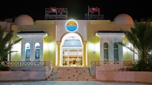 A hotel entrance with a sign reading 'JOYA Paradise' and a dome-shaped structure above. - Joya Paradise (Djerba Midun)