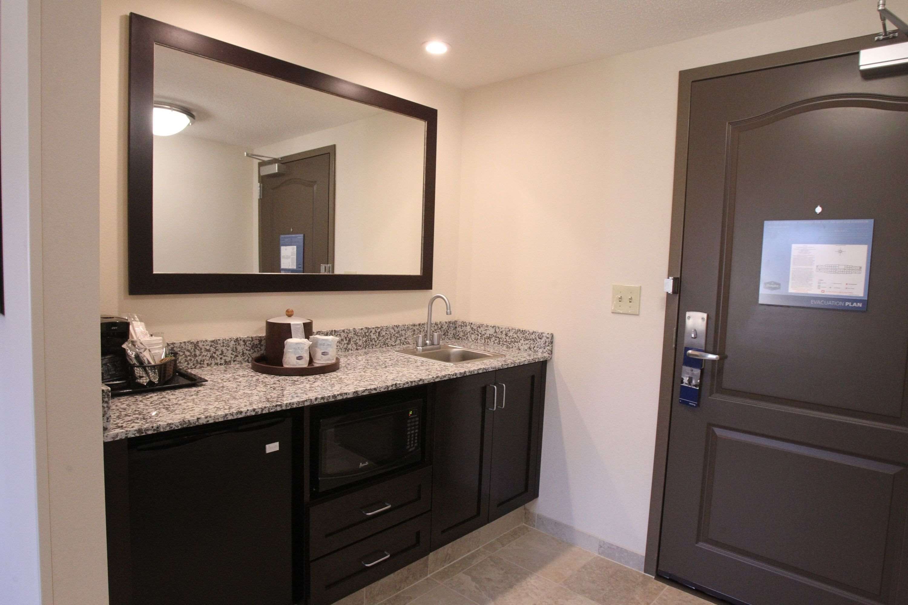 studio suite, 1 king bed | bathroom | hair dryer, towels