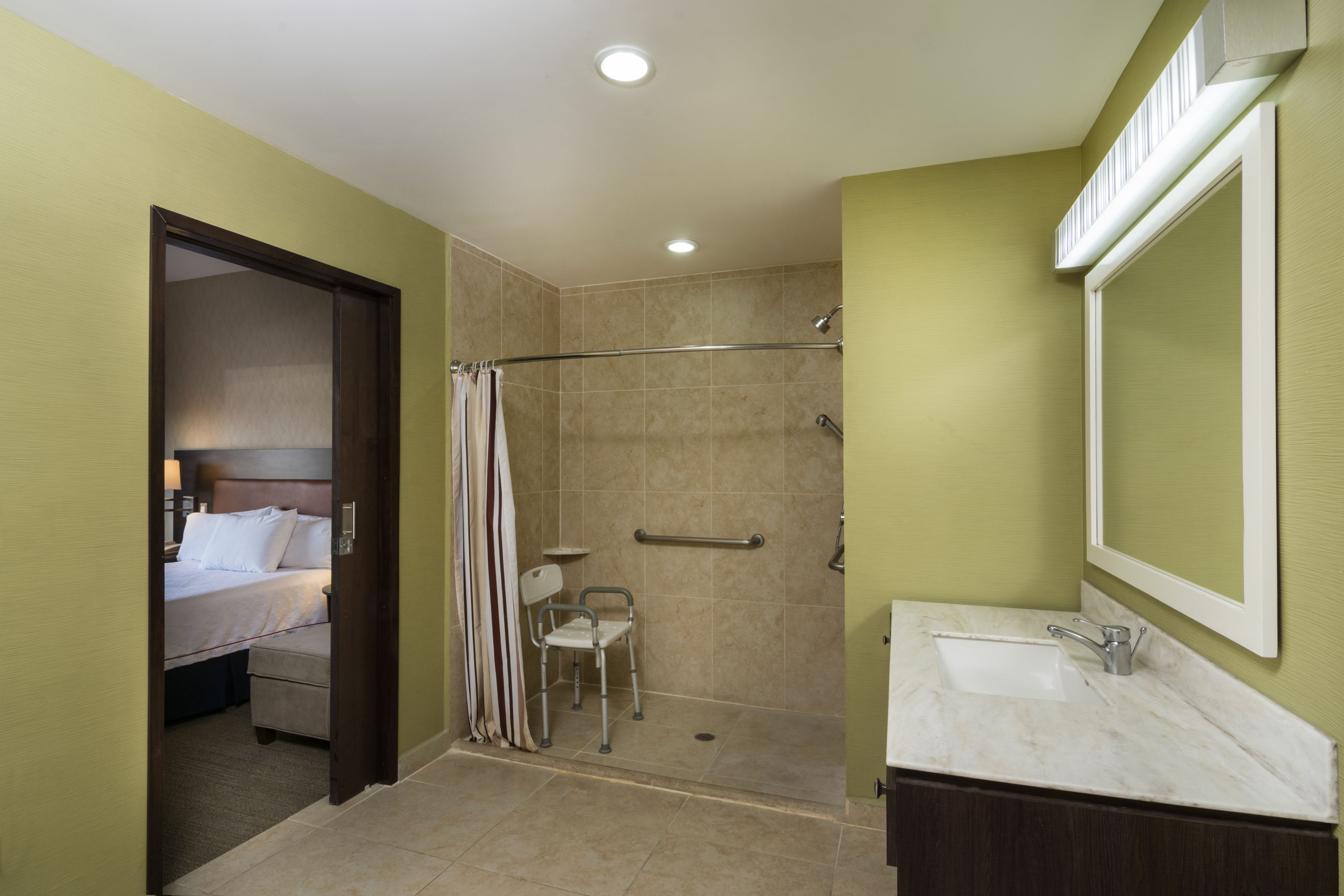 shower, rainfall showerhead, hair dryer, towels