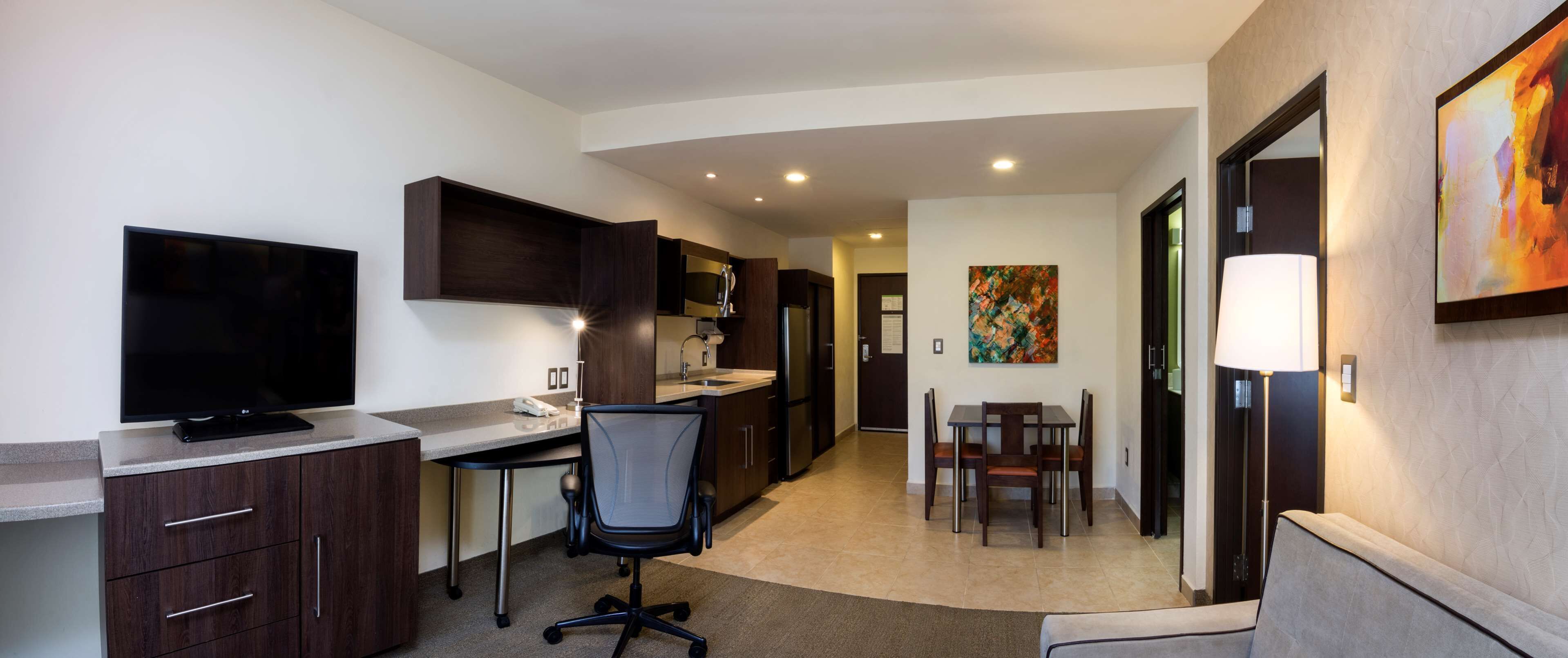 suite, 1 bedroom, non smoking | in-room safe, desk, laptop workspace, blackout curtains