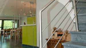 A modern staircase with metal railings leading to an upper floor. - Gasthof Kapelhof (Erpe-Mere)