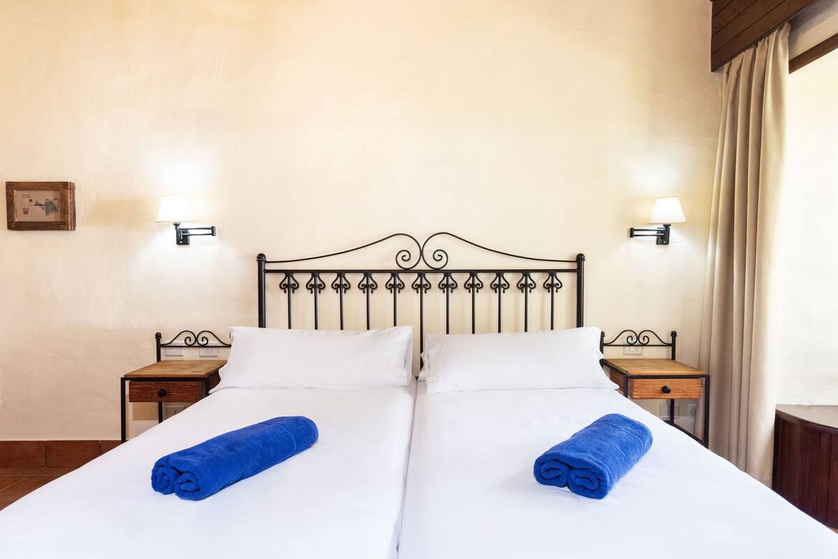Down comforters, blackout drapes, cribs (free), WiFi (free)