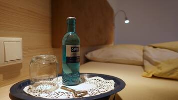 A bottle of Selters Classic on a tray with a glass jar and a spoon.