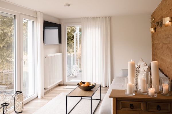 Panoramic Apartment, 1 Queen Bed, Kitchenette, Garden View | Living area | TV
