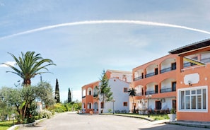 A building with multiple balconies and a central courtyard.