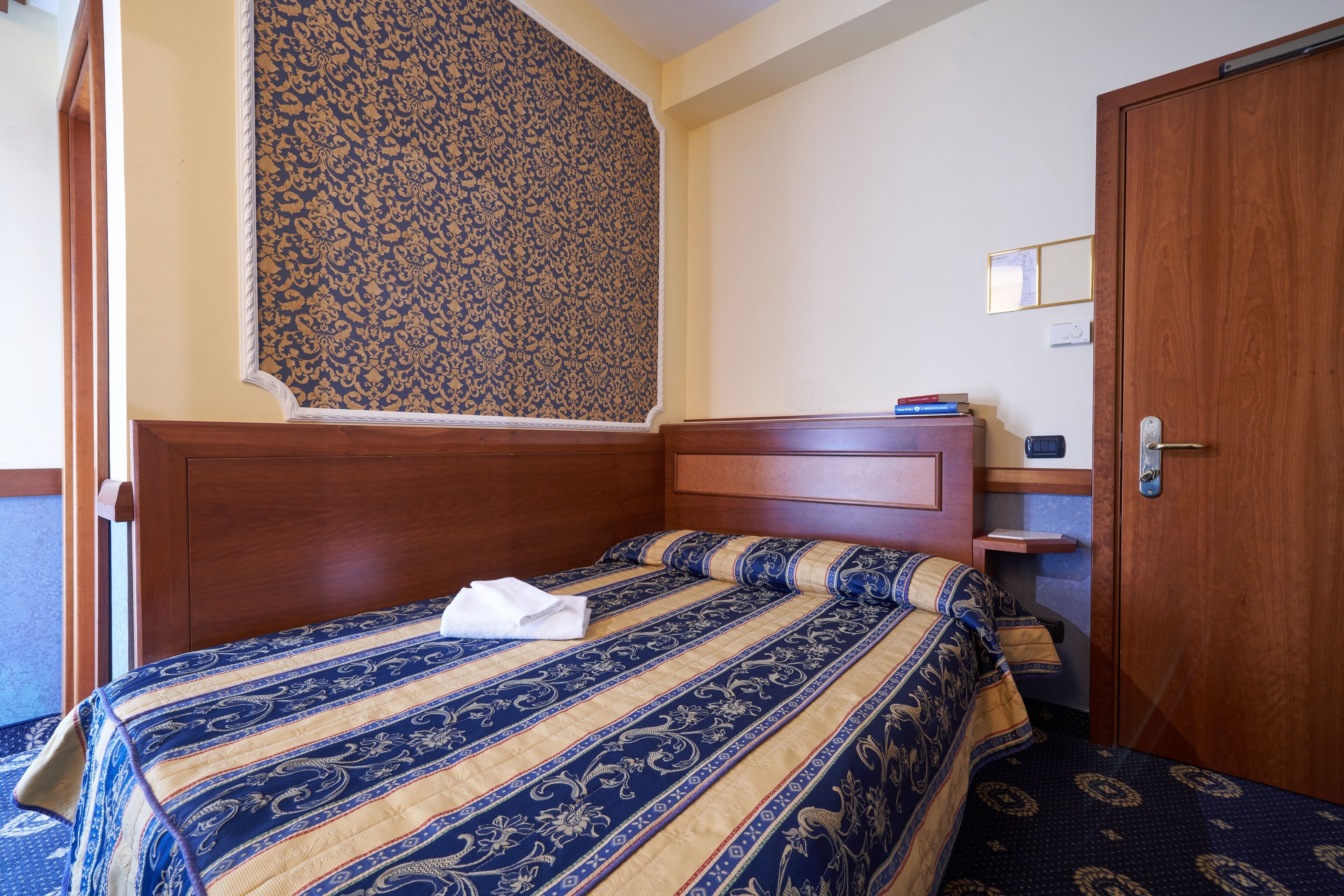 premium bedding, desk, laptop workspace, blackout curtains