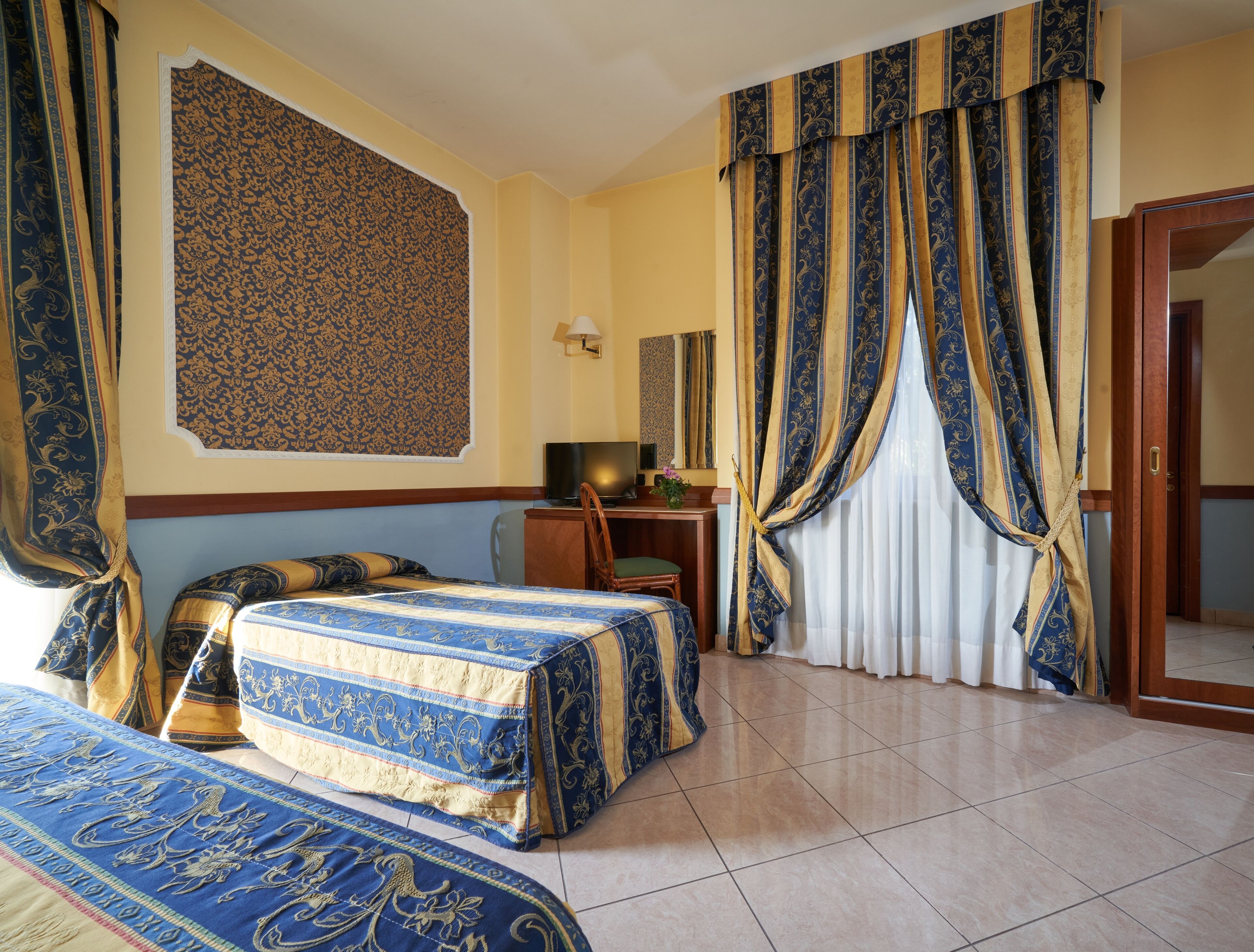 classic triple room | premium bedding, desk, laptop workspace, blackout curtains