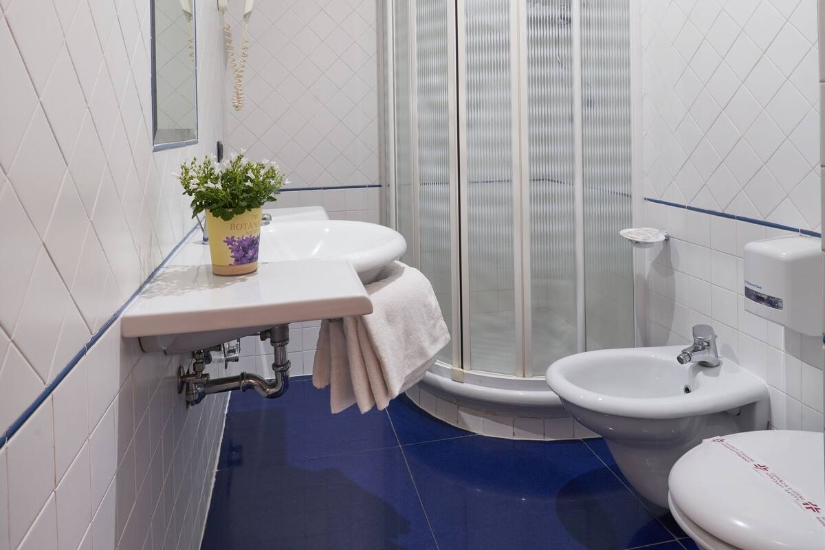 classic triple room | bathroom | shower, rainfall showerhead, eco-friendly toiletries, hair dryer