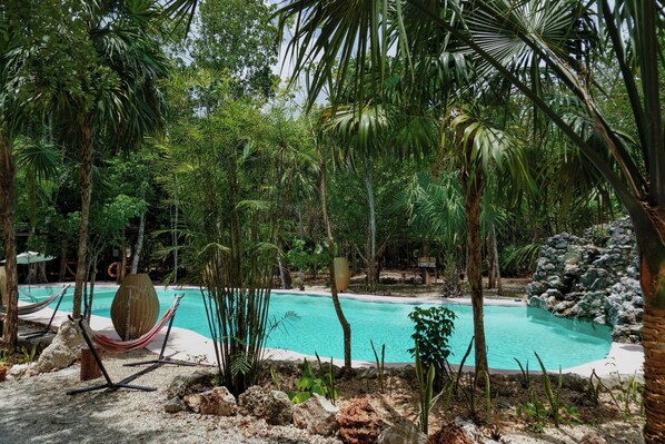 Outdoor pool, open 7:00 AM to 7:30 PM, pool umbrellas