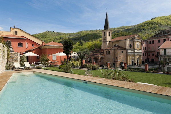 Outdoor pool, pool umbrellas, sun loungers