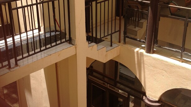 A multi-level building with balconies and staircases. - Nikki Hotel (Niamey)