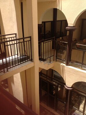 A multi-level building with balconies and staircases. - Nikki Hotel (Niamey)