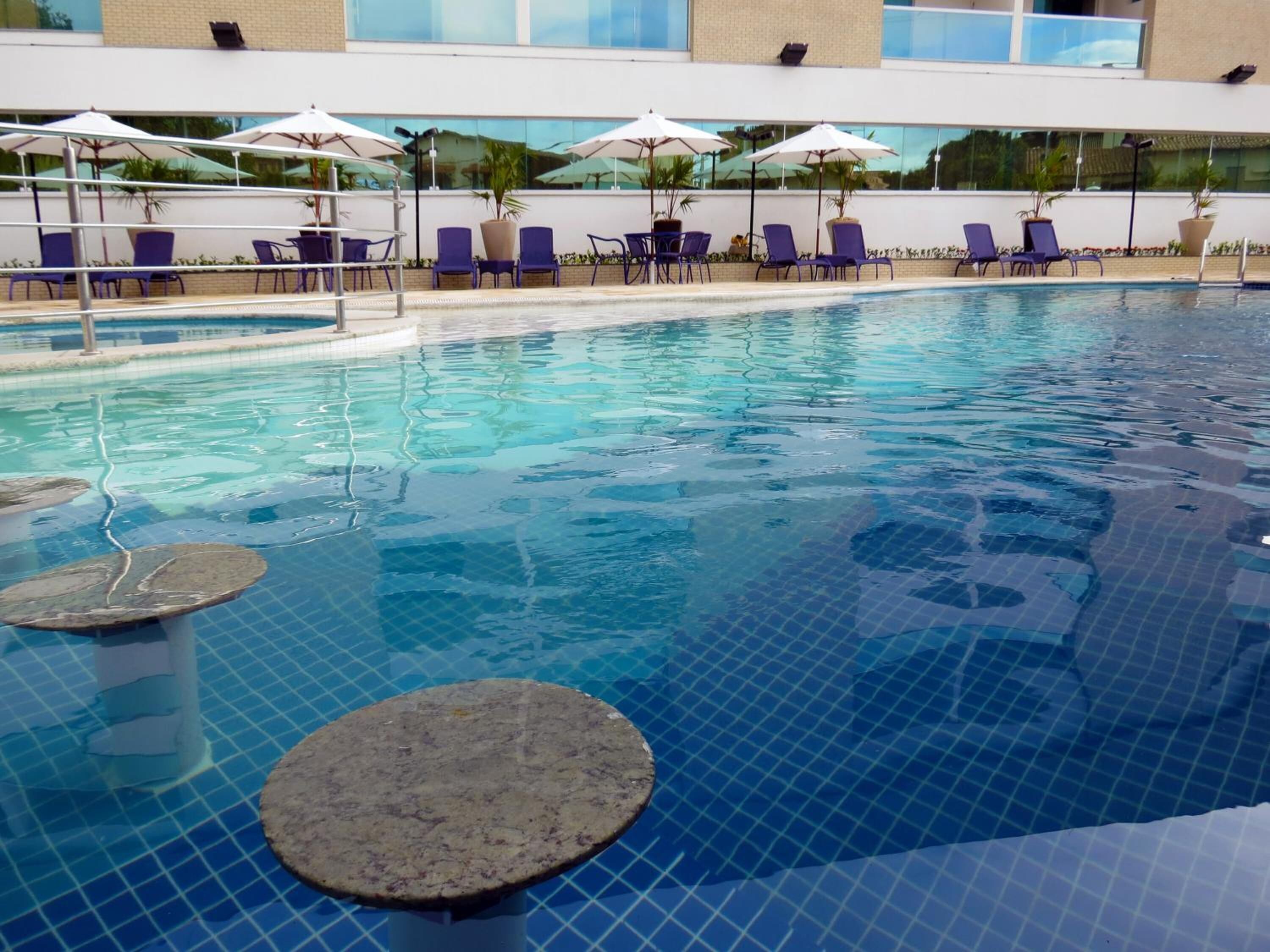 outdoor pool, pool umbrellas, pool loungers