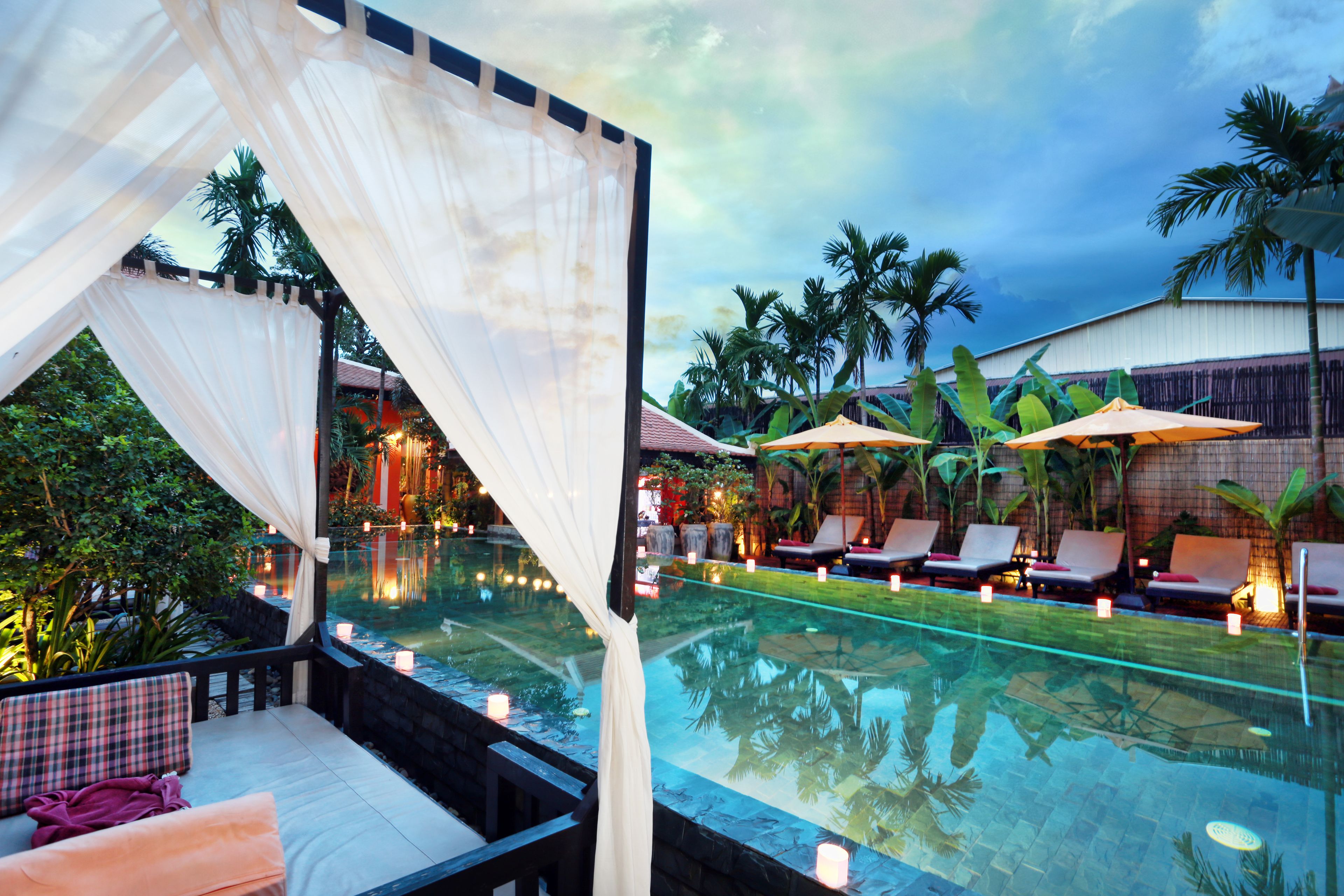 outdoor pool, open 9:00 am to 9:00 pm, free pool cabanas, pool umbrellas