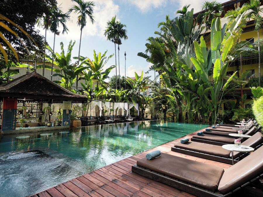 Outdoor pool, open 9:00 AM to 9:00 PM, pool umbrellas, sun loungers