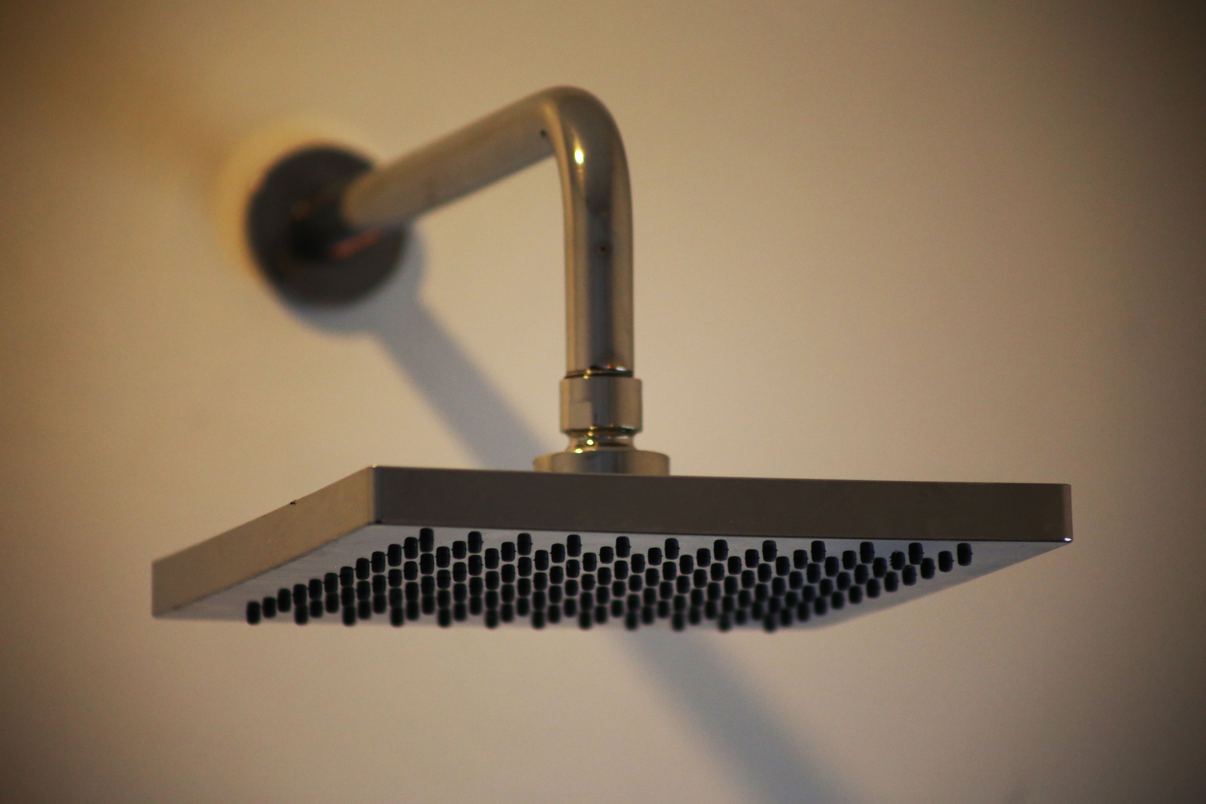 separate bathtub and shower, rainfall showerhead, designer toiletries