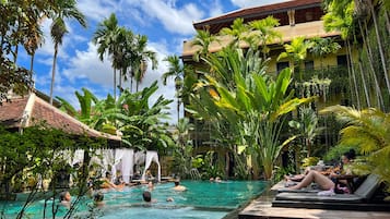 Outdoor pool, open 9:00 AM to 9:00 PM, free cabanas, pool umbrellas