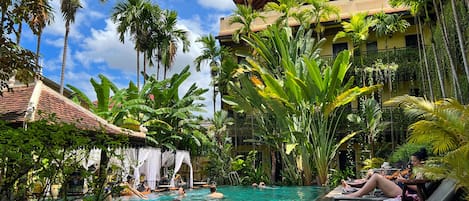 Outdoor pool, open 9:00 AM to 9:00 PM, free cabanas, pool umbrellas