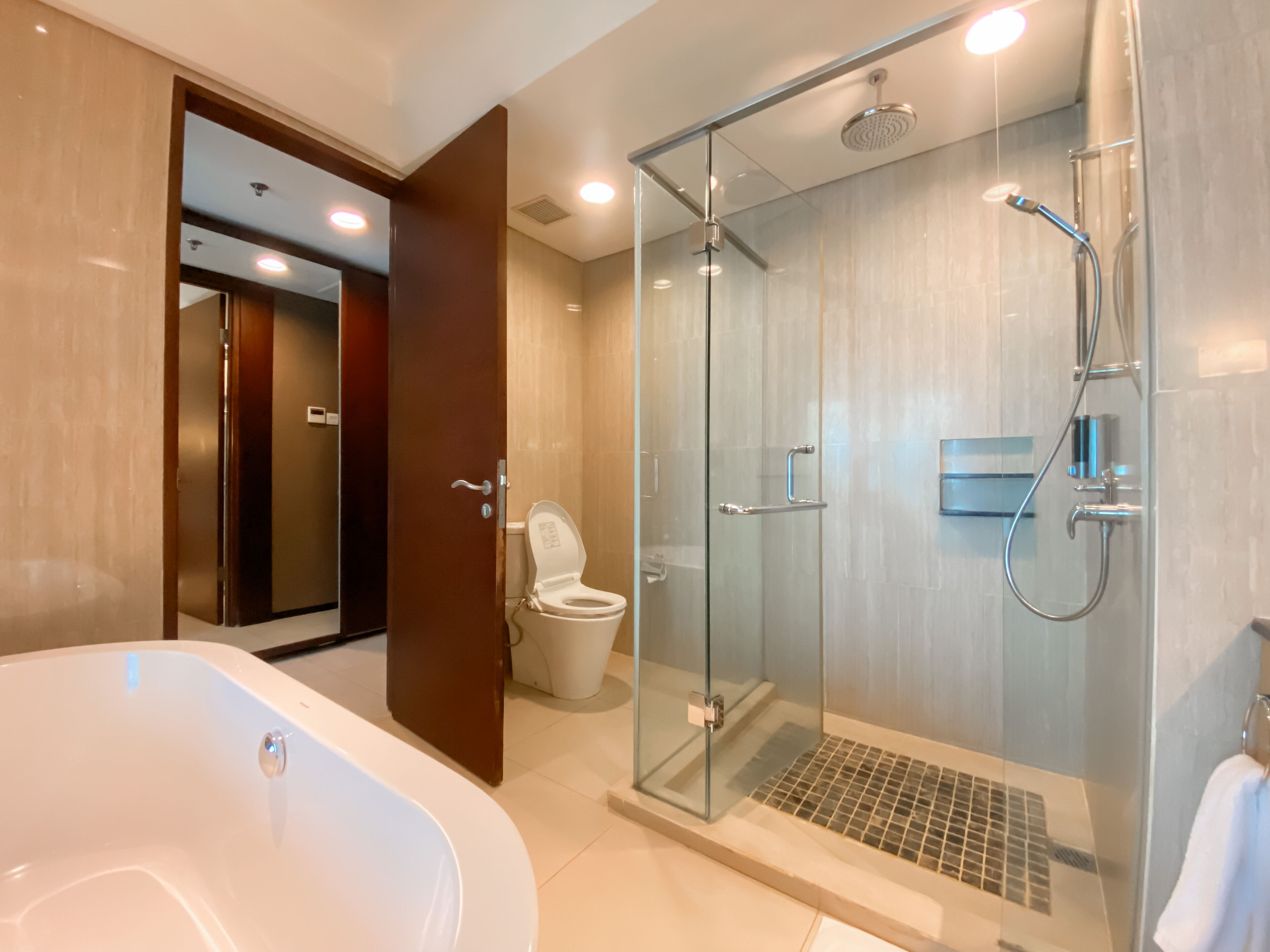 premier club room | bathroom | shower, slippers, towels, toilet paper