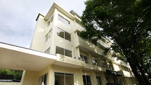A multi-story building with a sign reading "GRIYA SINTEMA".