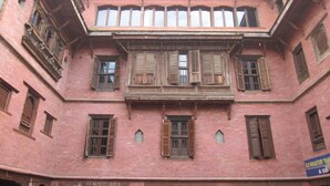 A traditional building with multiple windows and a balcony. - World Heritage Hotel & Aparments (Kathmandu)