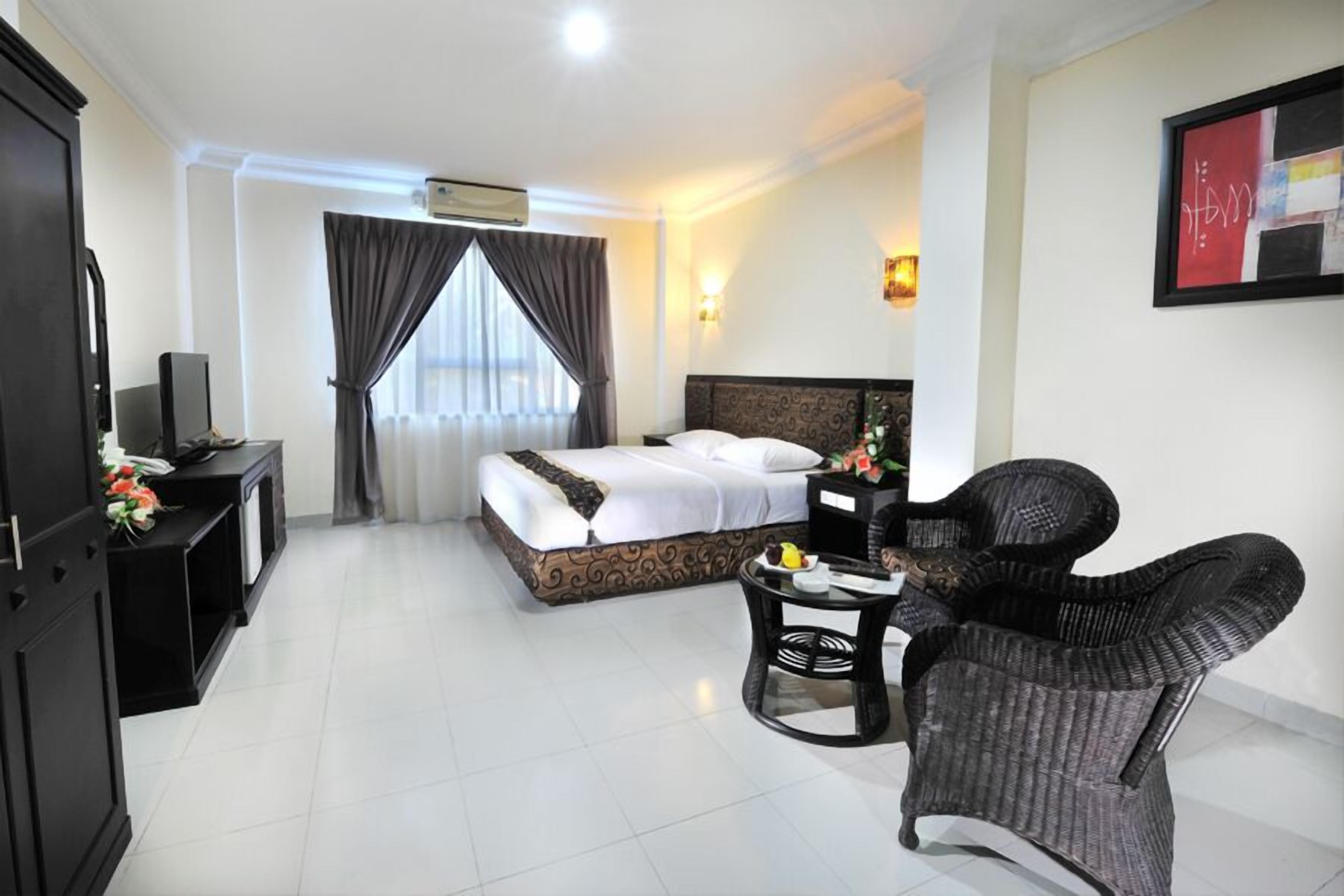 Habitación ejecutiva | Minibar, caja de seguridad en la habitación y wifi gratis 