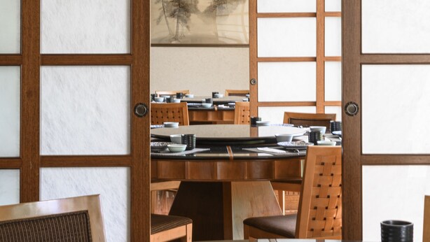 A traditional Japanese room with tatami flooring, a low table with a tea set, and sliding doors with shoji screens. - Lakeshore Hotel (Hsinchu)