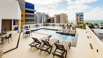 Outdoor pool, pool umbrellas, sun loungers