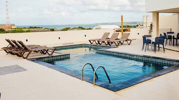 Outdoor pool, pool umbrellas, sun loungers